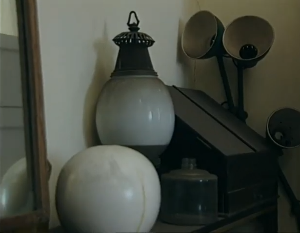 Documentary reference — lantern-style glass globe lamp