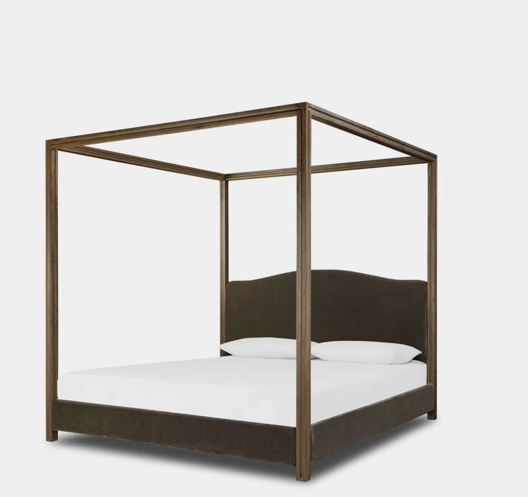 Canopy bed, photographed on white.