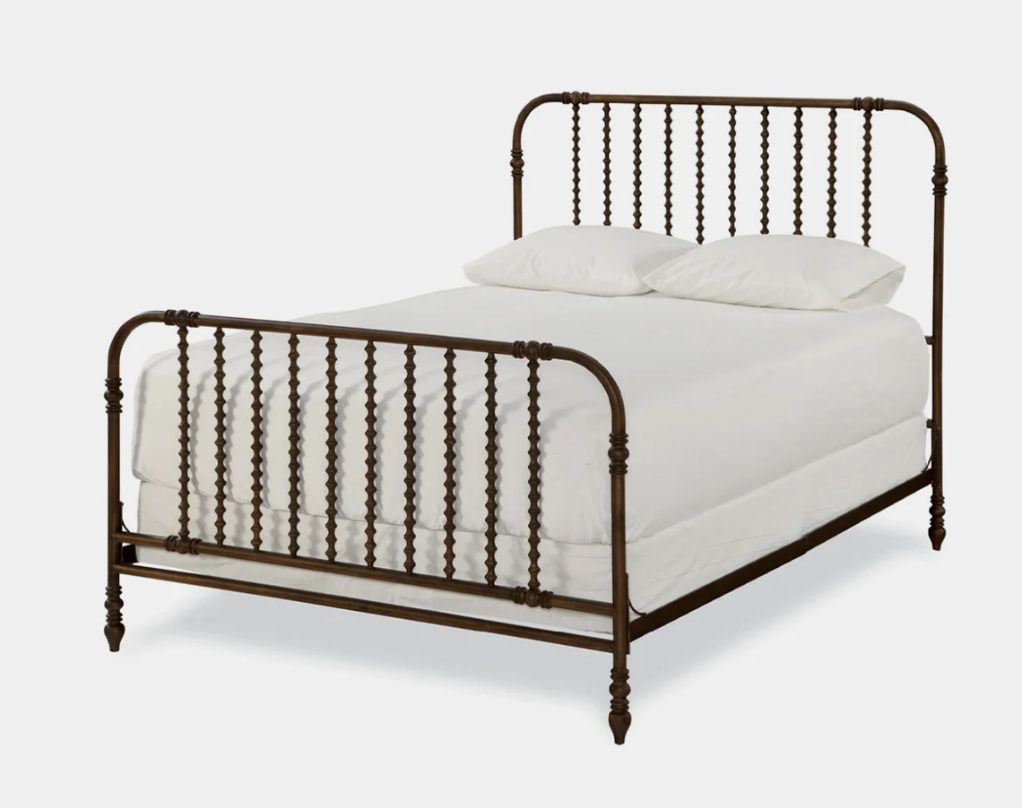 Metal-frame bed, photographed on white.