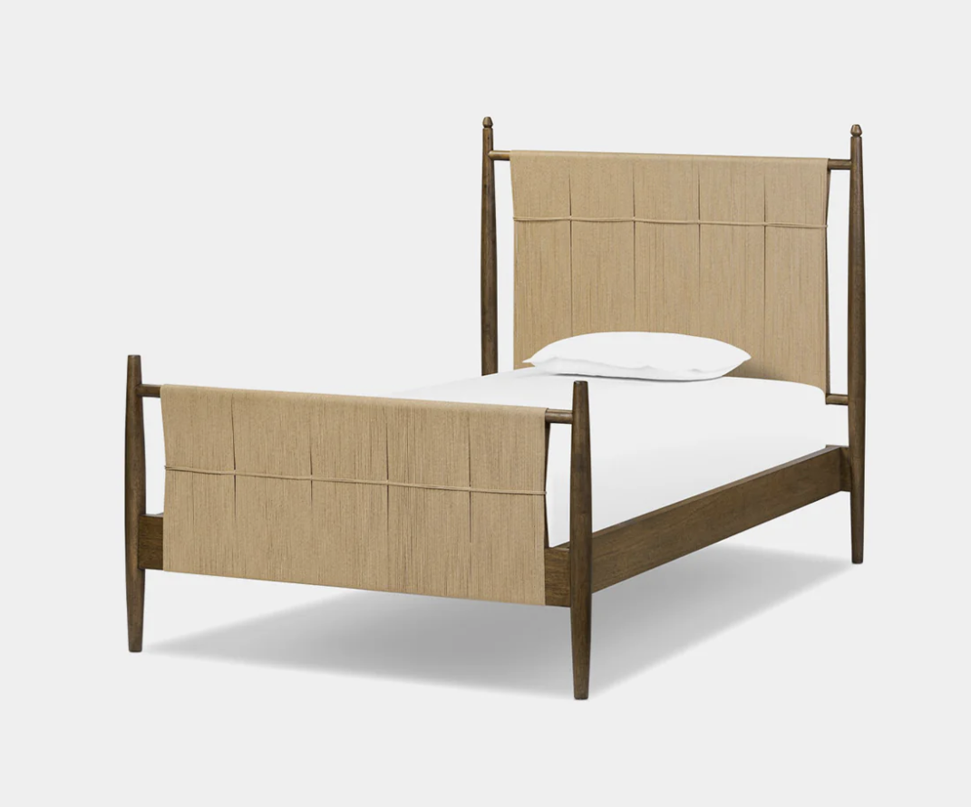Woven bed, photographed on white.