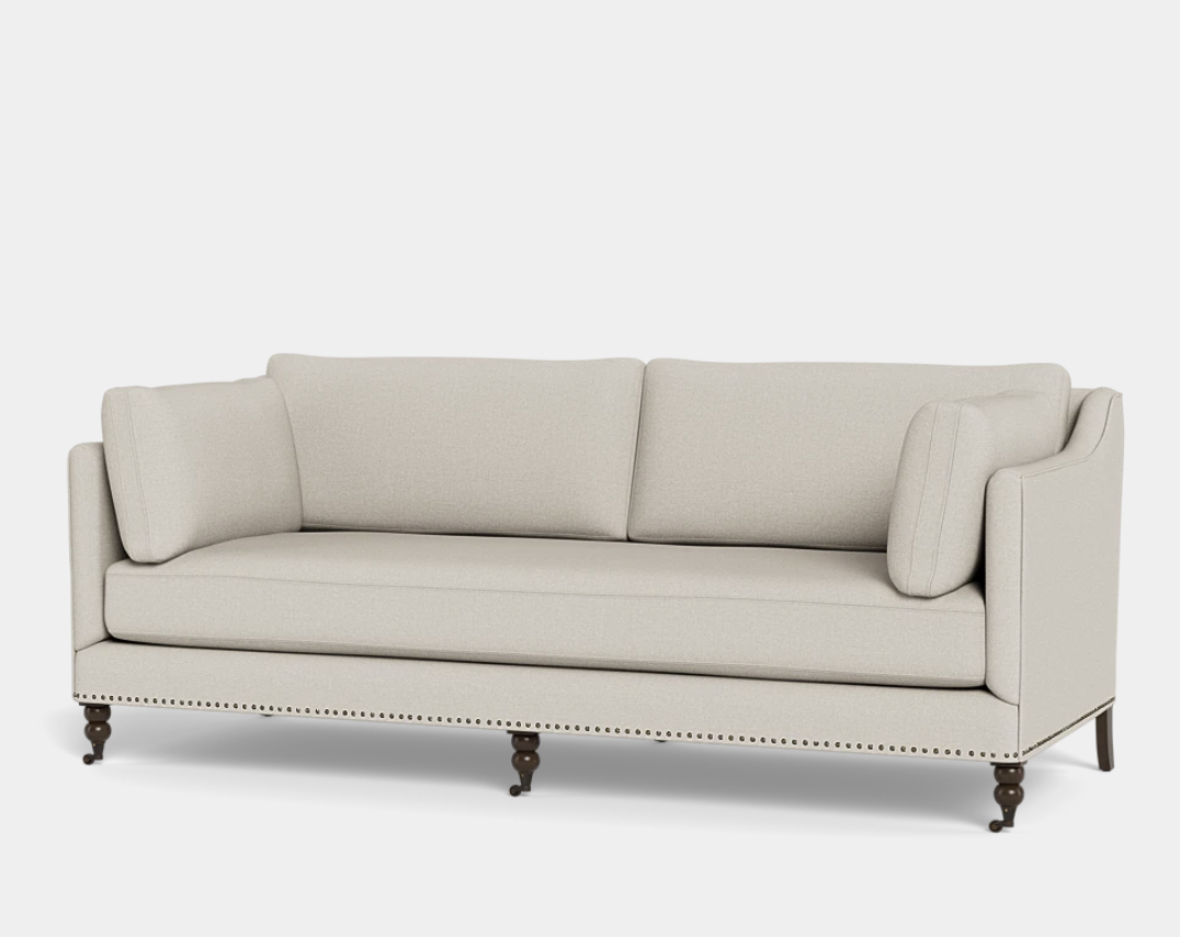 Nailhead sofa, photographed on white.