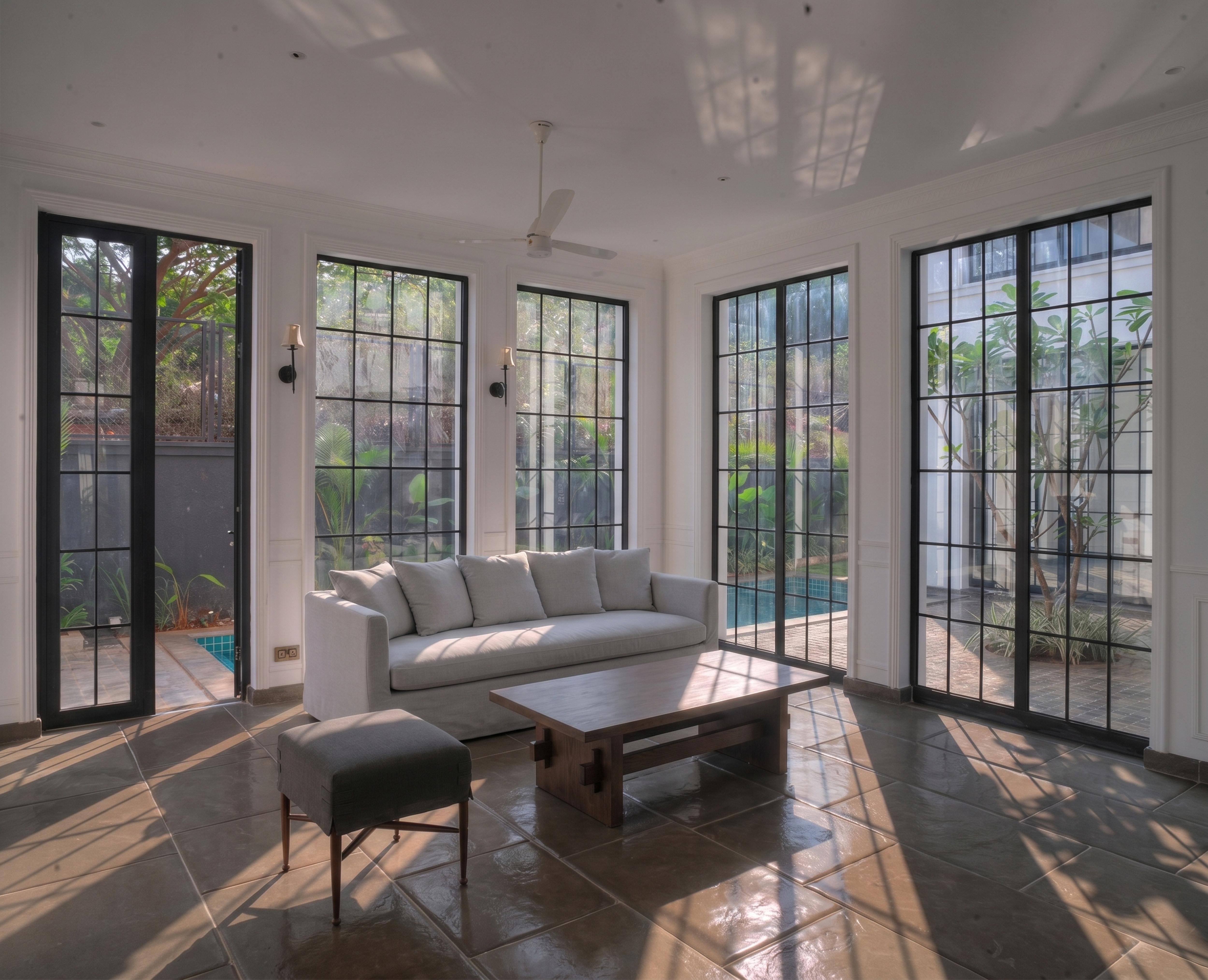 Garden room with the sofa anchoring the centre.